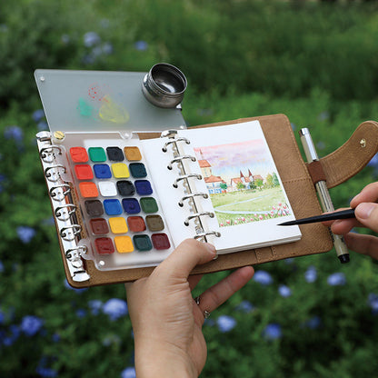 Watercolor Travel Sketching Set – Includes travel brushes (sizes 2, 4, 6), paints, and 100% cotton paper with PU Leather Cover (metal water container)